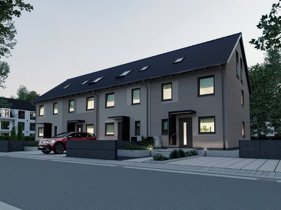 Modernes Massivhaus Mainz 128 mit vier Wohneinheiten bei Abendlicht Straßenansicht mit Eingangsbereich